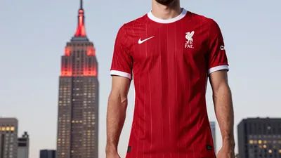 Liverpool F.C. reveals new kit, celebrated with Empire State Building lights in red, as the Reds gear up for the new season