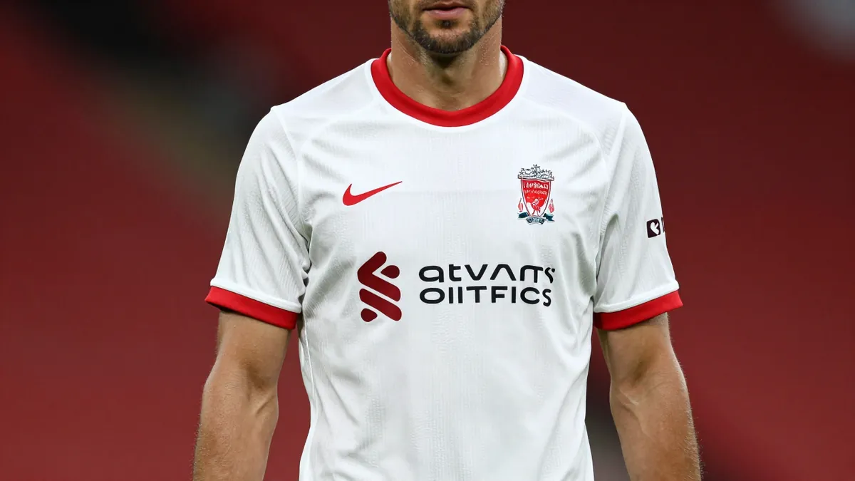 Liverpool F.C. unveils its 2026/27 Adidas away kit, a white strip with red and grey details, featuring CLIMACOOL+ tech...