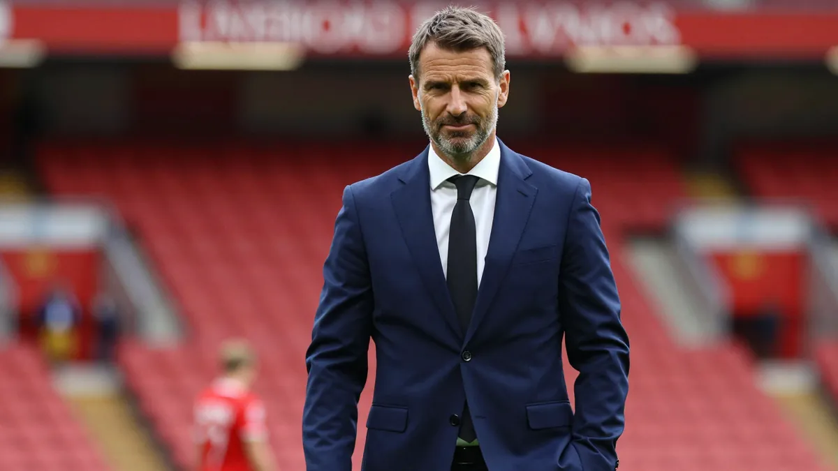 Liverpool F.C. owner Fenway Sports Group sells a minority stake in the Premier League club to a consortium led by Amit Bhatia