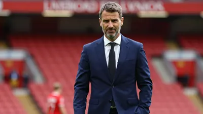 Liverpool F.C. owner Fenway Sports Group sells a minority stake in the Premier League club to a consortium led by Amit Bhatia
